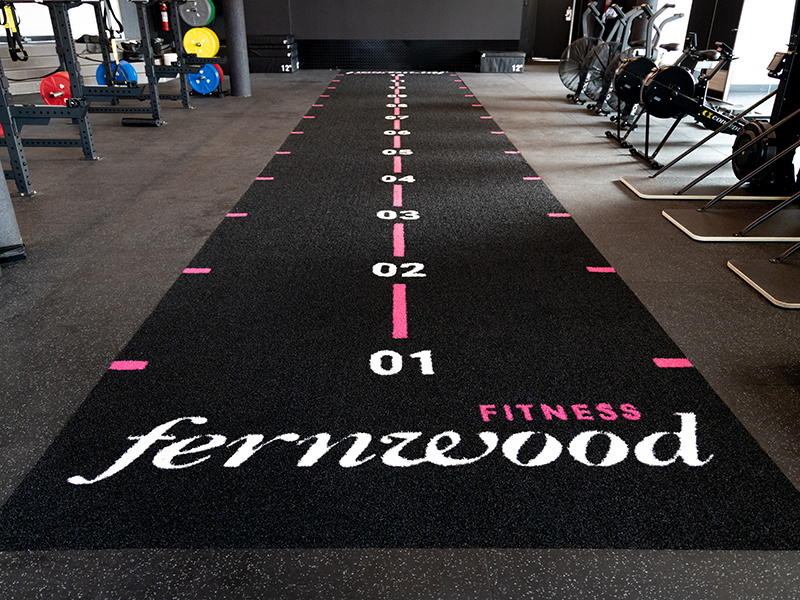 Fernwood Fitness Custom Turf Sled Track by Arena Flooring