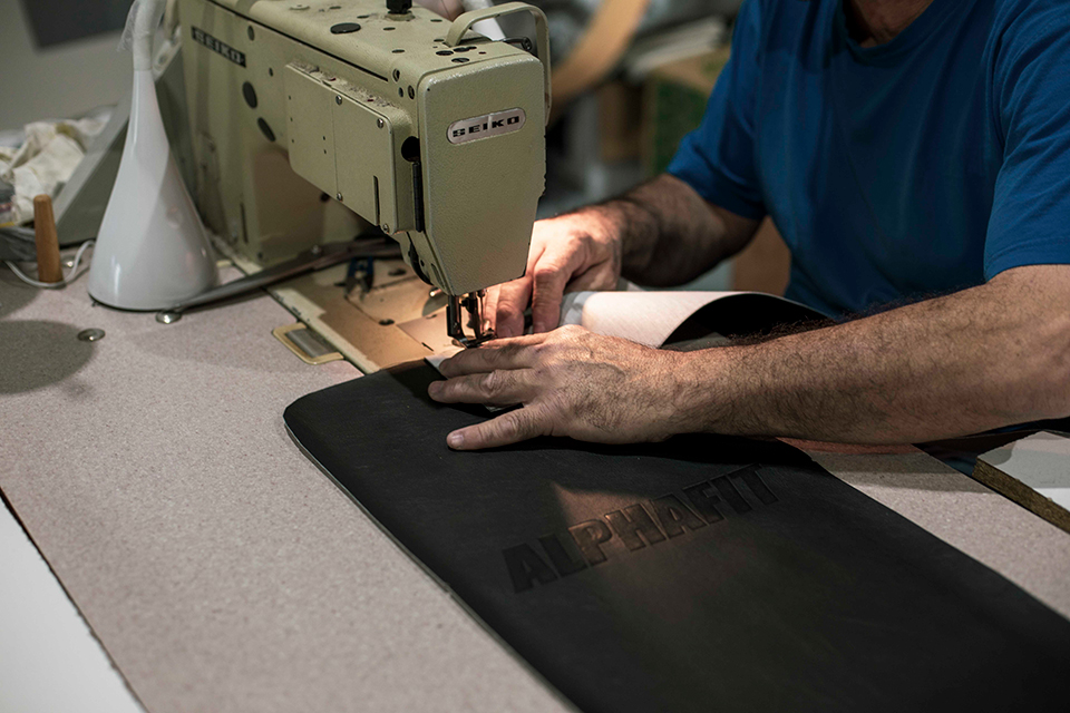 Michael sewing an AlphaFit bench pad cover